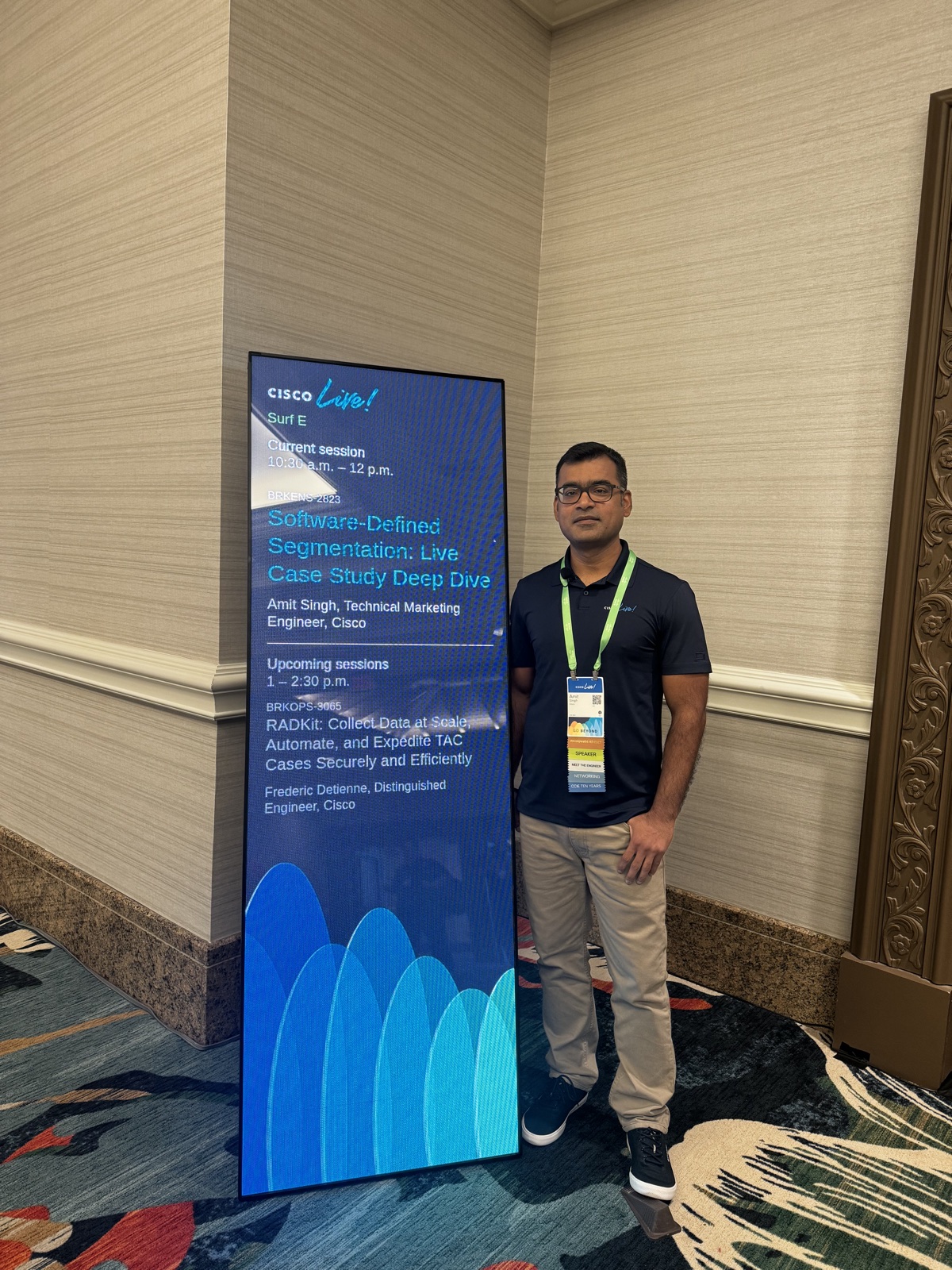 Amit Singh beside Cisco Live speaker signage identifying him for BRKENS-2823